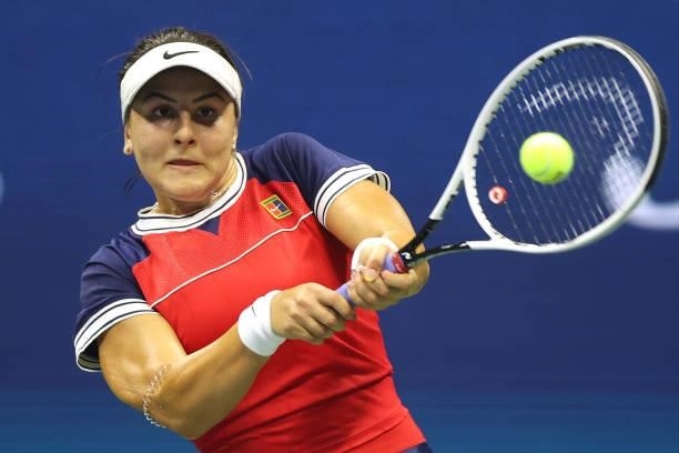 Bianca Andreescu of Canada returns a shot against Viktorija Golubic of Switzerland during her Women's Singles first round match on Day Two of the...