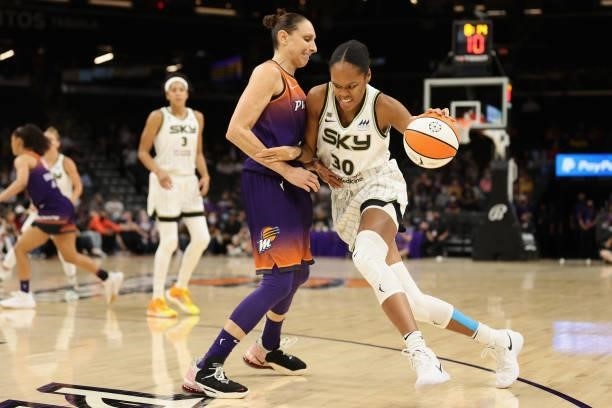 Azurá Stevens of the Chicago Sky drives the ball against Diana Taurasi of the Phoenix Mercury during the first half of the WNBA game at the Footprint...