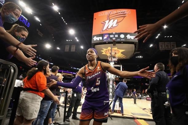 Shey Peddy of the Phoenix Mercury high fives fans following the WNBA game against the Chicago Sky at the Footprint Center on August 31, 2021 in...