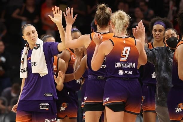 Diana Taurasi of the Phoenix Mercury high fives teammates after defeating the Chicago Sky in the WNBA game at the Footprint Center on August 31, 2021...
