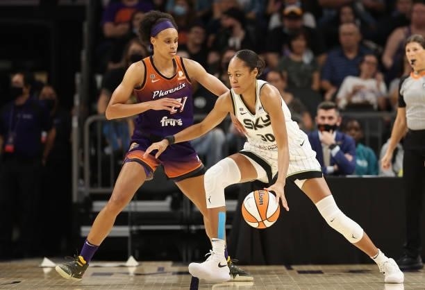 Azurá Stevens of the Chicago Sky handles the ball against Brianna Turner of the Phoenix Mercury during the second half of the WNBA game at the...