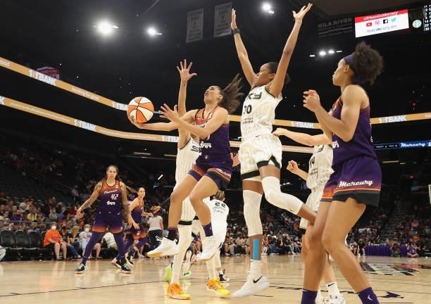 Skylar Diggins-Smith of the Phoenix Mercury drives the ball past Azurá Stevens of the Chicago Sky during the second half of the WNBA game at the...