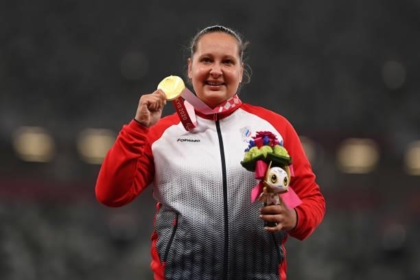 Gold medalist Galina Lipatnikova of Team RPC poses for photographs on the podium at the medal ceremony for the Women's Shot Put - F36 on day 8 of the...