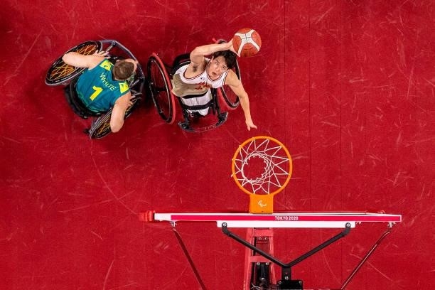Samuel White of Team Australia and Renshi Chokai of Team Japan fight for the ball in the men's Wheelchair Basketball quarterfinal on day 8 of the...