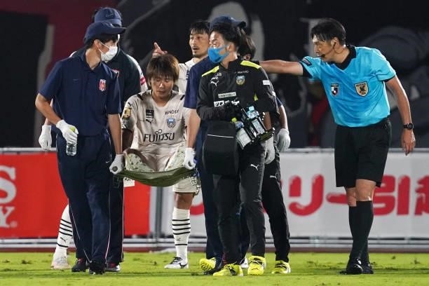 Shintaro Kurumaya of Kawasaki Frontale is stretchered off the pitch being injured during the J.League YBC Levain Cup quarter final first leg between...