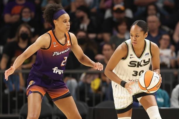 Azurá Stevens of the Chicago Sky handles the ball against Brianna Turner of the Phoenix Mercury during the second half of the WNBA game at the...