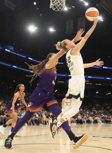Courtney Vandersloot of the Chicago Sky attempts a shot past Brittney Griner of the Phoenix Mercury during the first half of the WNBA game at the...