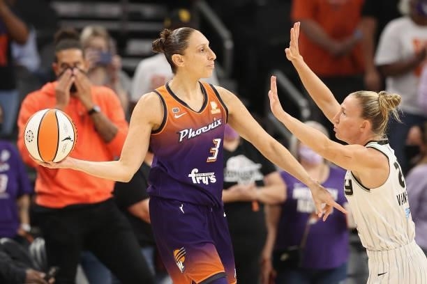 Diana Taurasi of the Phoenix Mercury looks to pass around Courtney Vandersloot of the Chicago Sky during the first half of the WNBA game at the...