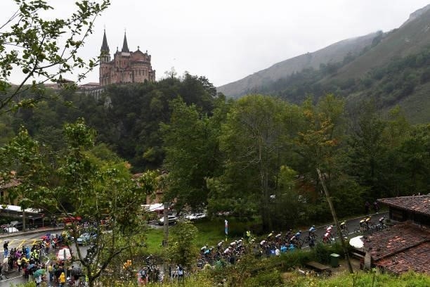 General view of the Peloton passing in front of The Monastery of Covadonga while fans cheer during the 76th Tour of Spain 2021, Stage 17 a 185,5km...