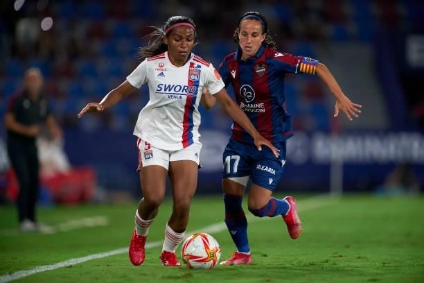 Maria Alharilla of Levante UD competes for the ball with Perle Morroni of Lyon during UEFA Women's Champions League Round 2 match between Levante UD...