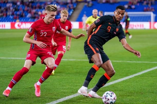 Marcus Holmgren Pedersen of Norway, Cody Gakpo of the Netherlands during the World Cup Qualifier match between Norway and Netherlands at Ullevaal...