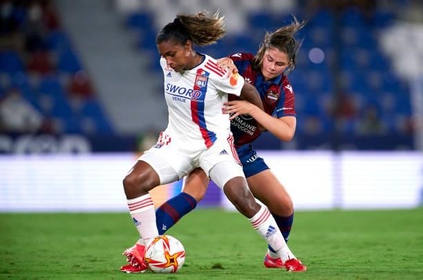 Maria Mendez of Levante UD competes for the ball with Catarina Macario of Lyon during UEFA Women's Champions League Round 2 match between Levante UD...