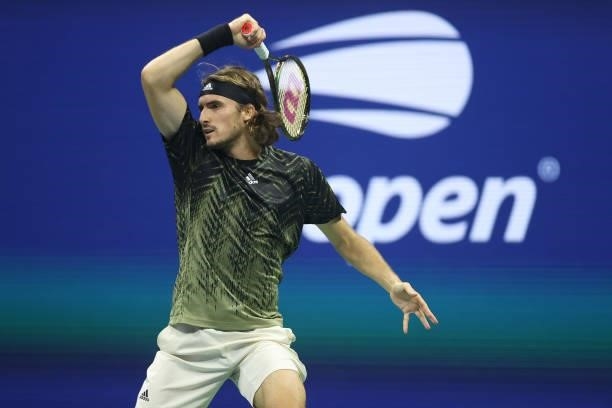 Stefanos Tsitsipas of Greece returns the ball against Adrian Mannarino of France during his Men's Singles second round match on Day Three of the 2021...