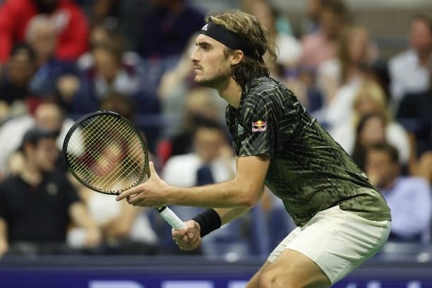 Stefanos Tsitsipas of Greece looks to return against Adrian Mannarino of France during his Men's Singles second round match on Day Three of the 2021...