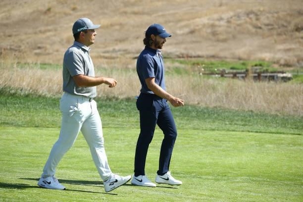 Francesco Molinari of Italy and Tommy Fleetwood of England walk together on the seventh hole during Day One of The Italian Open at Marco Simone Golf...
