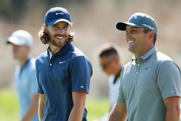 Tommy Fleetwood of England speaks to Edoardo Molinari of Italy on the 9th hole during Day One of The Italian Open at Marco Simone Golf Club on...