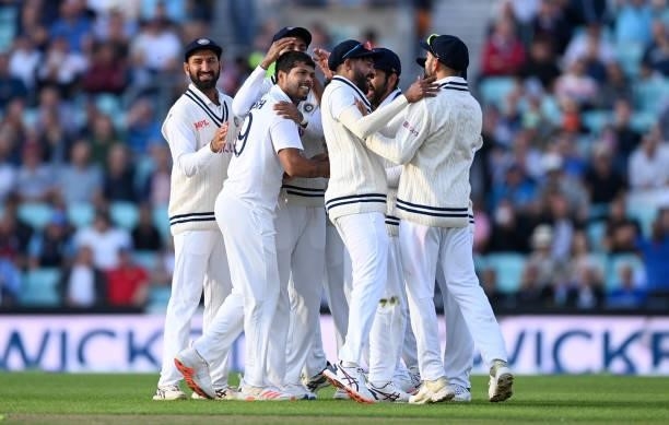 Umesh Yadav of India celebrates with teammates after bowling England captain Joe Root during day one of the Fourth LV= Insurance Test Match between...