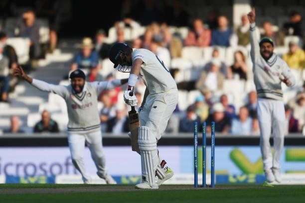 Joe Root of England is bowled by Umesh Yadav of India during the Fourth LV= Insurance Test Match: Day One between England and India at The Kia Oval...