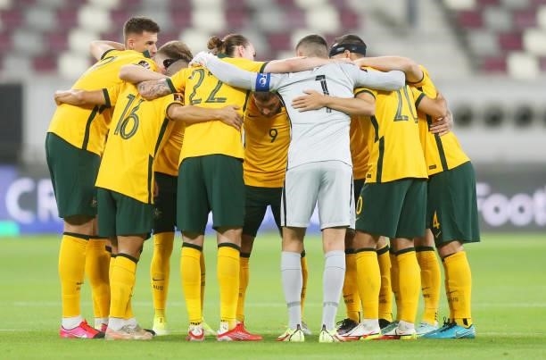 Australia players form a huddle during the 2022 FIFA World Cup Qualifier match between Australia and China PR at Khalifa International Stadium on...