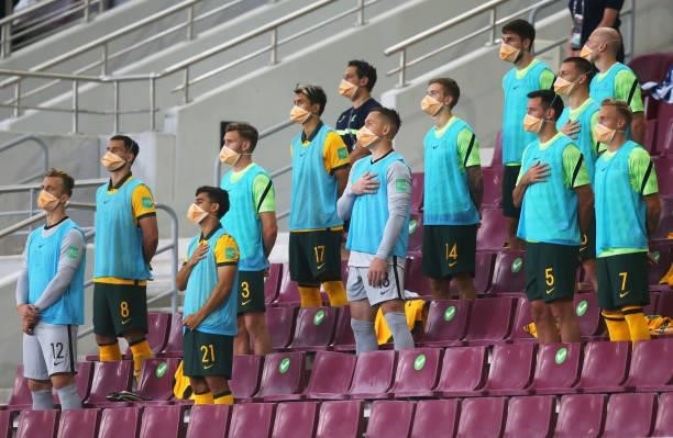 The Australia substitutes sing the national anthem during the 2022 FIFA World Cup Qualifier match between Australia and China PR at Khalifa...