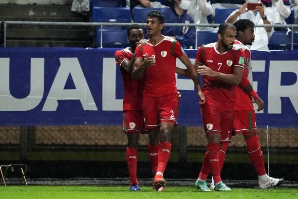 Issam Abdallah Al Sabhi of Oman celebrates scoring his side's first goal with his team mate FIFA World Cup Asian Qualifier Final Round Group B match...