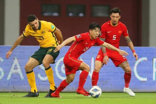 Tom Rogic of Australia and Jin Jingdao of China PR battle for the ball during the 2022 FIFA World Cup Qualifier match between Australia and China PR...