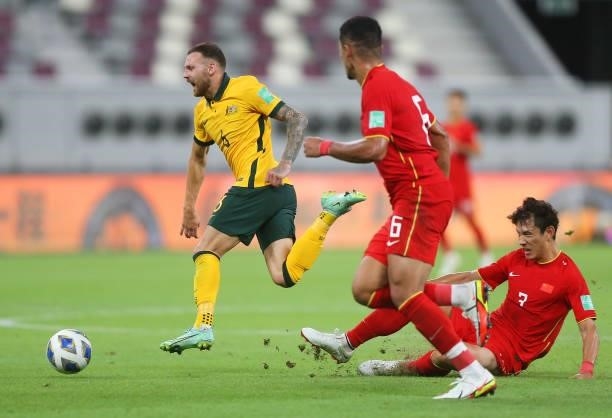 Martin Boyle of Australia and Wang Shenchao of China PR battle for the ball during the 2022 FIFA World Cup Qualifier match between Australia and...