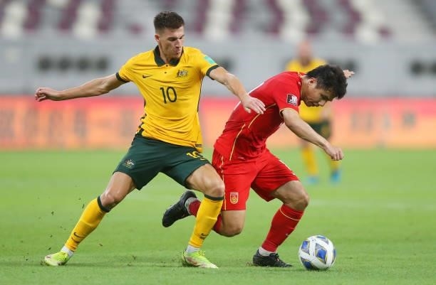 Ajdin Hrustic of Australia and Hao Junmin of China PR during the 2022 FIFA World Cup Qualifier match between Australia and China PR at Khalifa...