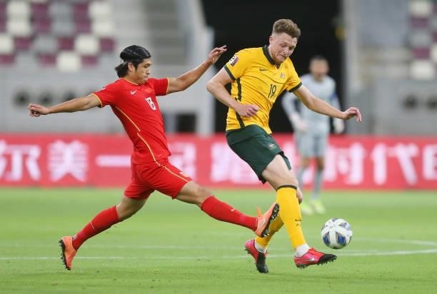 Zhang Yuning of China PR and Harry Souttar of Australia battle for the ball during the 2022 FIFA World Cup Qualifier match between Australia and...