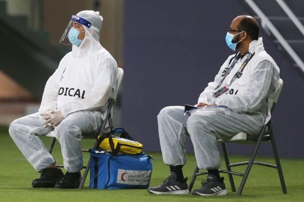 Medical staff wearing overalls look on during the 2022 FIFA World Cup Qualifier match between Australia and China PR at Khalifa International Stadium...