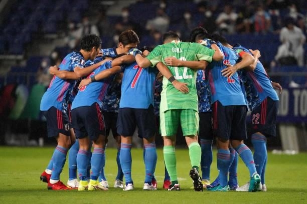 Players of Japan huddle prior to FIFA World Cup Asian Qualifier Final Round Group B match between Japan and Oman at Panasonic Stadium Suita on...