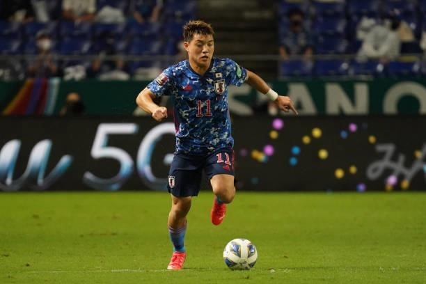 Ritsu Doan of Japan in action during FIFA World Cup Asian Qualifier Final Round Group B match between Japan and Oman at Panasonic Stadium Suita on...