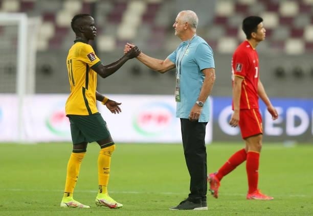Awer Mabil of Australia interacts with Graham Arnold, Head Coach of Australia after the 2022 FIFA World Cup Qualifier match between Australia and...