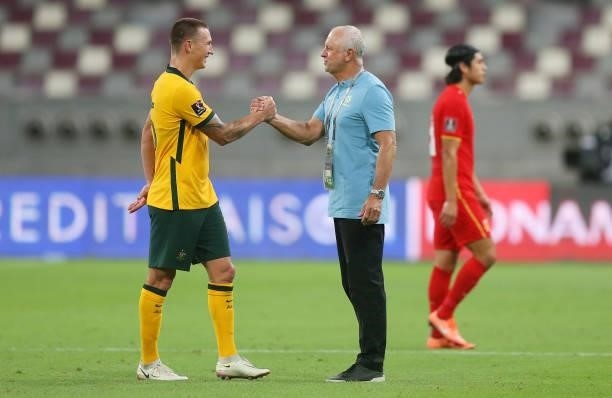 Mitchell Duke celebrates with Graham Arnold, Head Coach of Australia after the 2022 FIFA World Cup Qualifier match between Australia and China PR at...