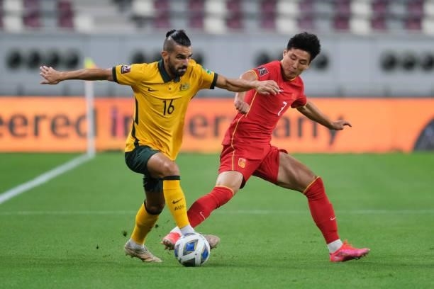 Wu Lei of China and Aziz Behich of Australia battle for the ball during Australia v China PR - 2022 FIFA World Cup Qualifier at Khalifa International...