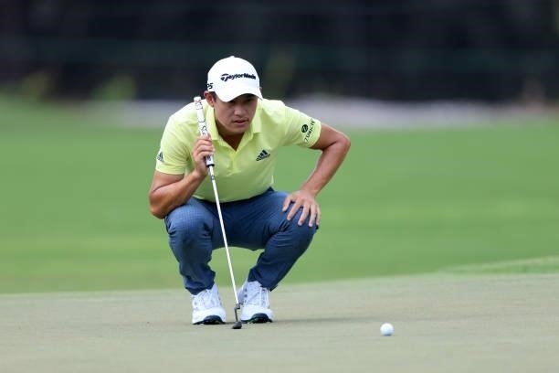 Collin Morikawa looks over a shot on the second hole during the first round of the TOUR Championship at East Lake Golf Club on September 02, 2021 in...