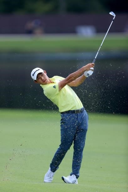 Collin Morikawa plays a shot on the eighth hole during the first round of the TOUR Championship at East Lake Golf Club on September 02, 2021 in...