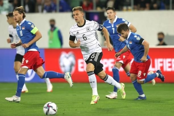 Joshua Kimmich of Germany runs with the ball during the 2022 FIFA World Cup Qualifier match between Liechtenstein and Germany at Kybunpark on...