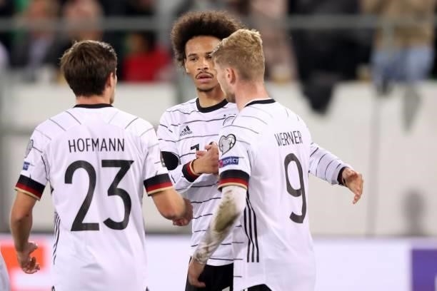 Leroy Sane of Germany celebrates scoring the 2nd team goal with team mated Timo Werner and Jonas Hofmann during the 2022 FIFA World Cup Qualifier...