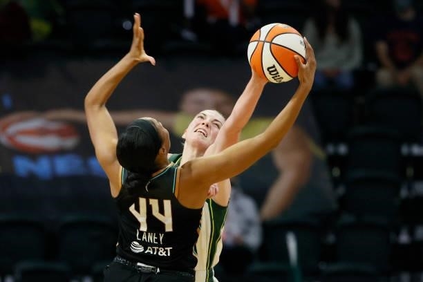 Katie Lou Samuelson of the Seattle Storm and Betnijah Laney of the New York Liberty fight for a rebound during the third quarter at Angel of the...