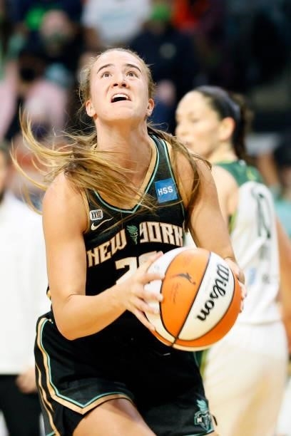 Sabrina Ionescu of the New York Liberty drives past Sue Bird of the Seattle Storm during the third quarter at Angel of the Winds Arena on September...