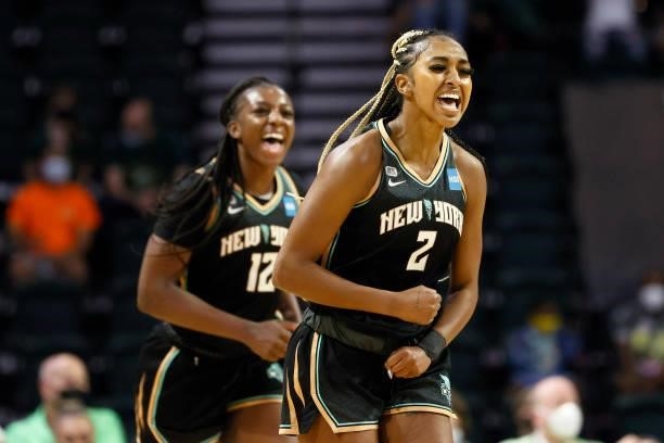 DiDi Richards of the New York Liberty reacts after a basket against the Seattle Storm during the first quarter at Angel of the Winds Arena on...