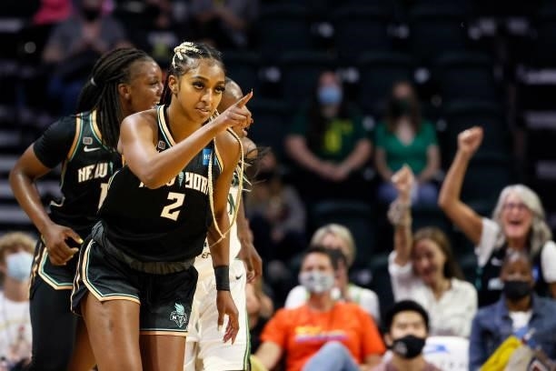 DiDi Richards of the New York Liberty reacts after a basket against the Seattle Storm during the first quarter at Angel of the Winds Arena on...