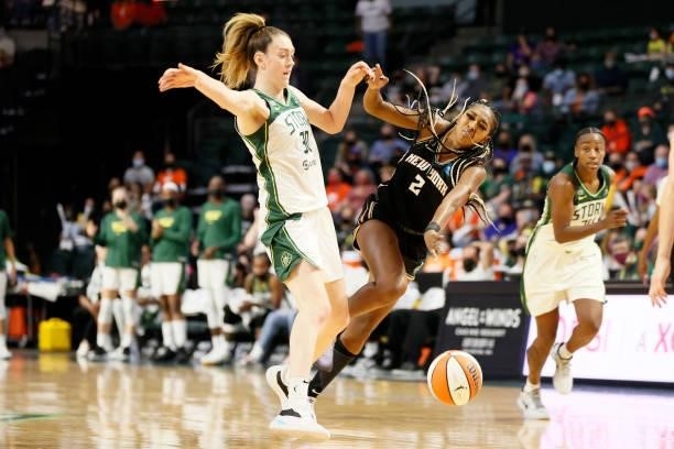 Breanna Stewart of the Seattle Storm collides with DiDi Richards of the New York Liberty during the fourth quarter at Angel of the Winds Arena on...