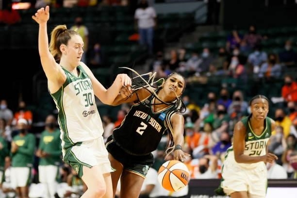 Breanna Stewart of the Seattle Storm collides with DiDi Richards of the New York Liberty during the fourth quarter at Angel of the Winds Arena on...