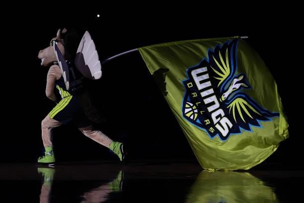 Dallas Wings mascot Lightning waves the team flag as the Wings prepare to take the court against the Atlanta Dream at College Park Center on...