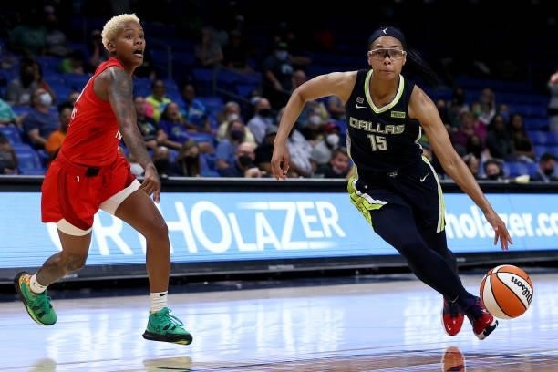 Guard Allisha Gray of the Dallas Wings drives to the basket against guard Courtney Williams of the Atlanta Dream in the second half at College Park...