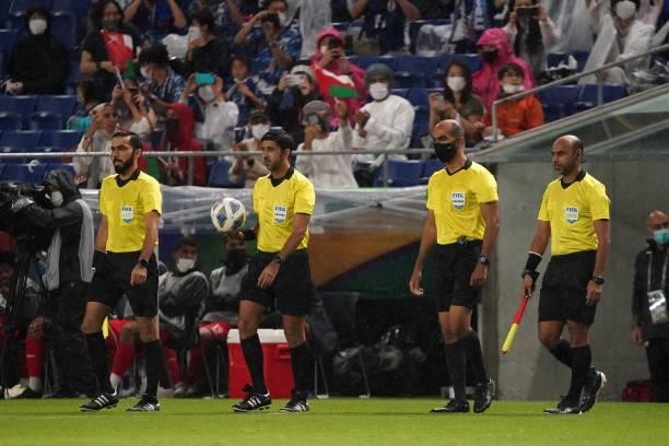 Referees enter the pitch prior to FIFA World Cup Asian Qualifier Final Round Group B match between Japan and Oman at Panasonic Stadium Suita on...