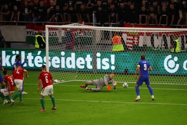 Péter Gulácsi of Hungary can"u2019t stop Harry Maguire shot that gave England a 3-0 lead during the 2022 FIFA World Cup Qualifiers match at Stadium...
