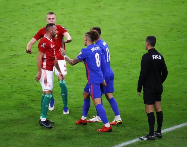 Ádám Nagy of Hungary tries to prevent team-mate Dániel Gazdag from confronting Mason Mount and Kalvin Phillips of England during the 2022 FIFA World...